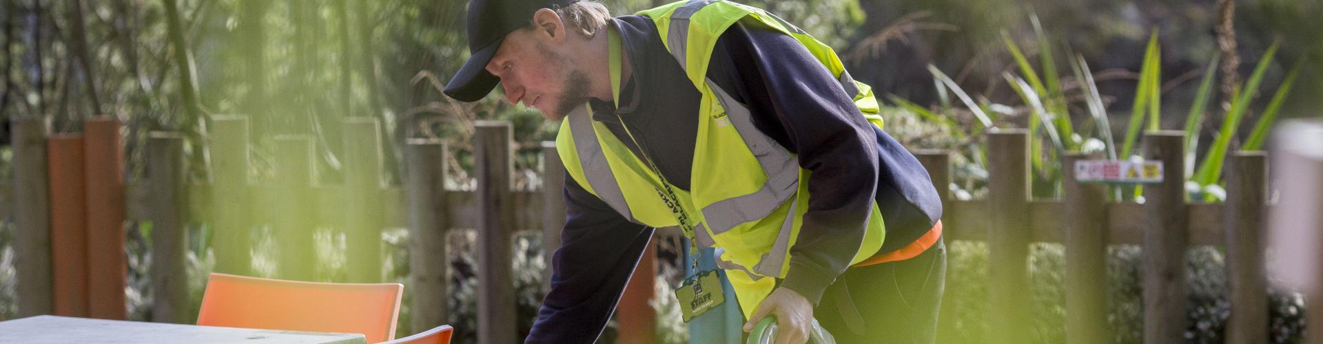 Photo of Richard wearing a yellow high viz waistcoat at work